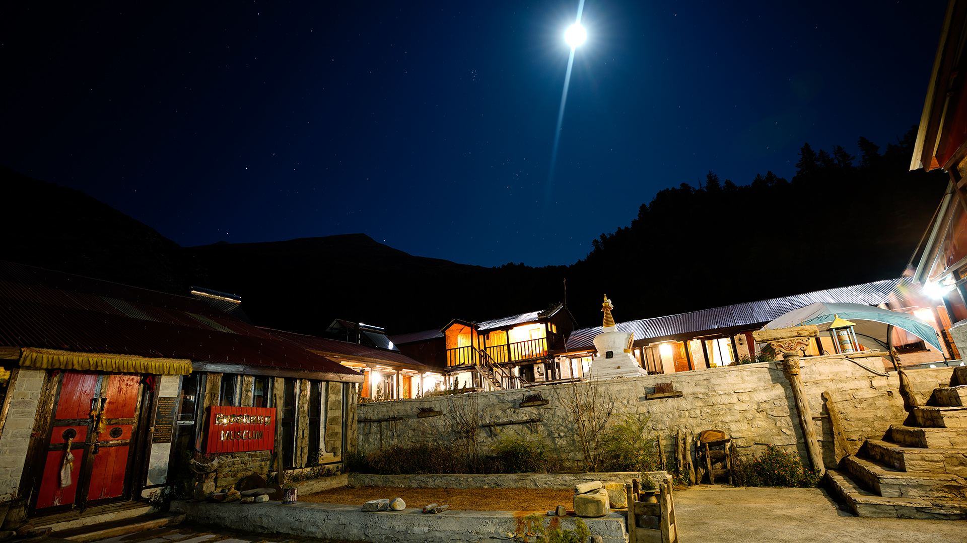 The Yak Ru race village lit up under a full moon